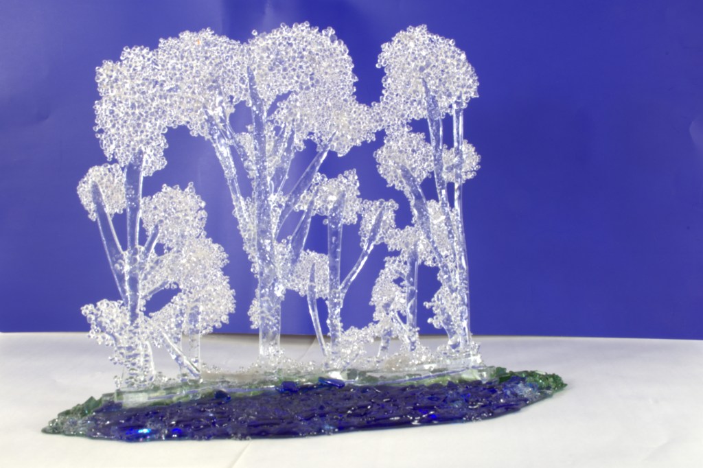 Frozen Trees Next to River Valley